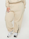 back view of model wearing Princess Polly Princess Polly Track Pants Block / Cursive Text Stone Curve High Waisted Pants 