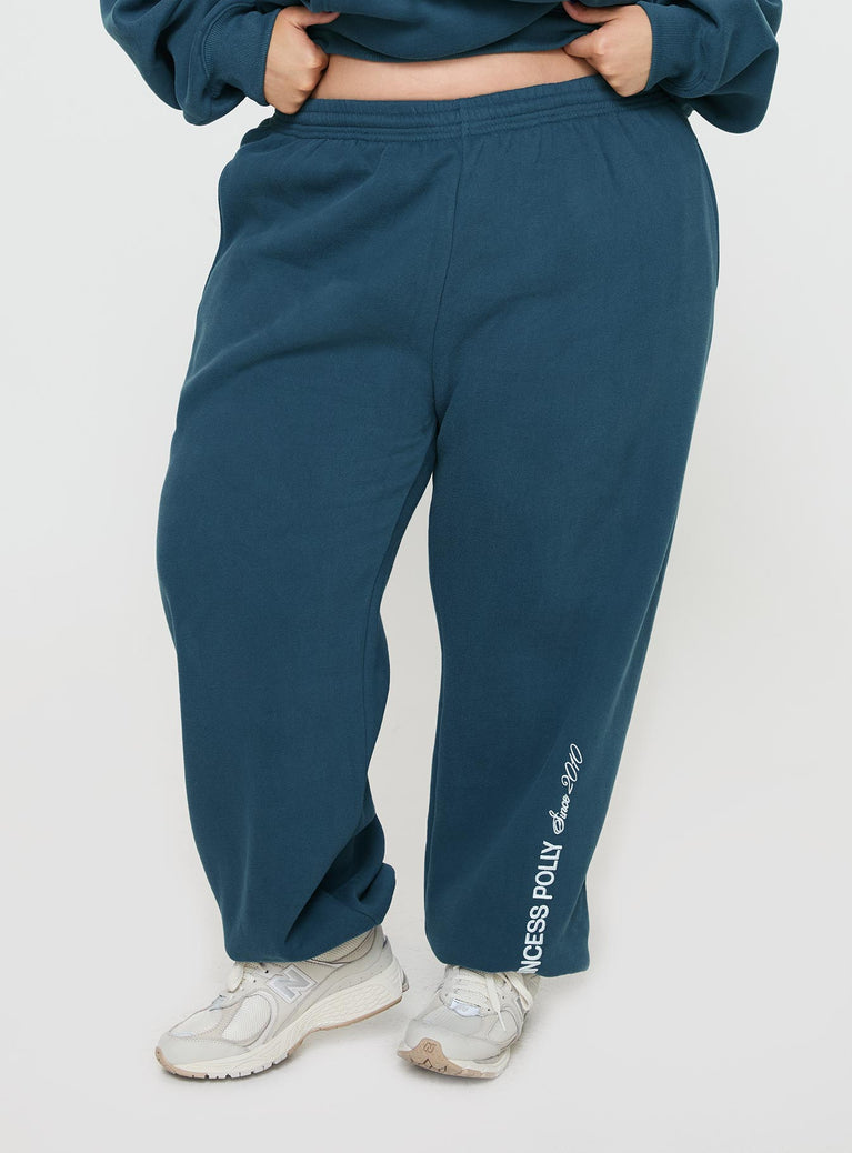 front view of model wearing Princess Polly Princess Polly Track Pants Block / Cursive Text Slate Curve 