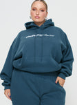 front view of model wearing Princess Polly Princess Polly Hooded Sweatshirt Block / Cursive Text Slate Curve 