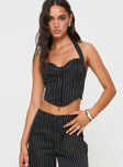 side view of model wearing Princess Polly Kimia Top Black / White Pinstripe Sleeveless Sweetheart 