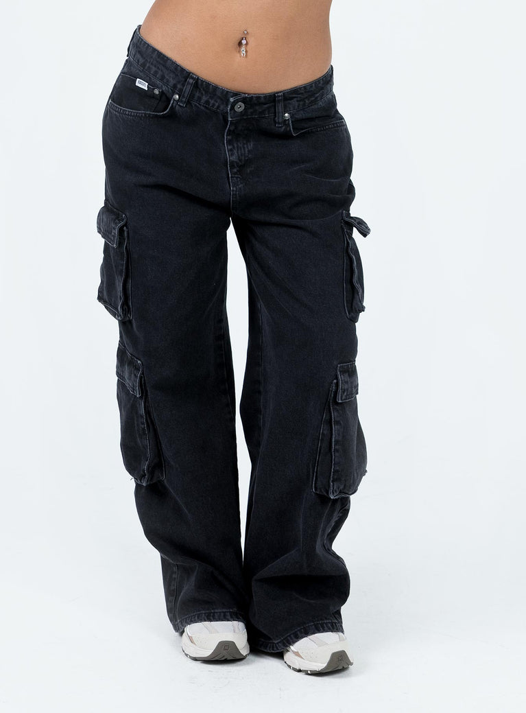 Front view of model wearing  front Princess Polly Low Rise Jeans  The Ragged Priest Black Combat Jeans Charcoal