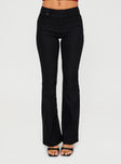 side view of model wearing Princess Polly Kinkirk Flared Pants Black Tall High Waisted Pants 