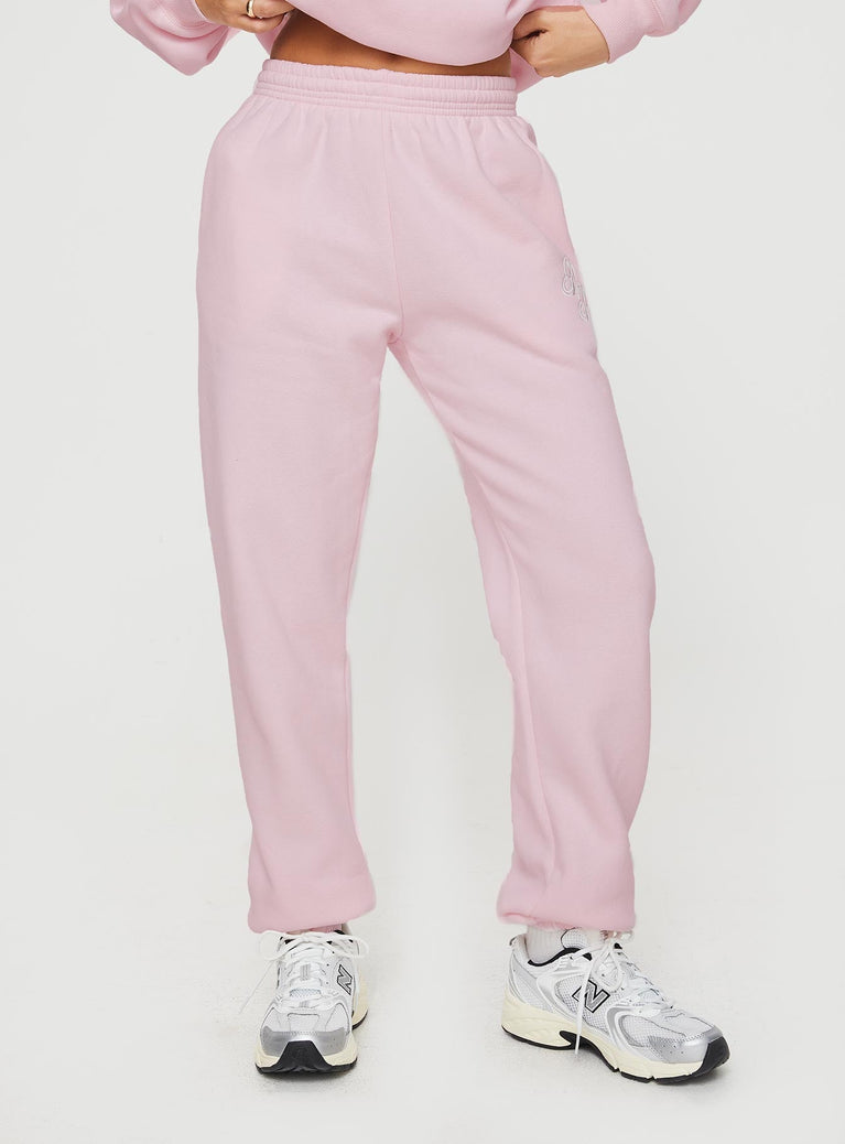 front view of model wearing Princess Polly Princess Polly Track Pants Script Baby Pink / Grey Mid Rise 