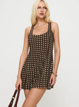 side view of model wearing Princess Polly Serina Polka Mini Dress Brown / White Scoop Neck 