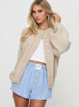 side view of model wearing Princess Polly Edern Cardigan Cream Long 