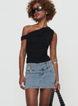   side view of model wearing Princess Polly Brinkman Mini Skirt Light Wash Denim Mini Skirts 