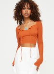 Front view of model wearing  front Princess Polly Full Sleeves Square Neck  Tyren Top Orange