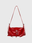 Shoulder bag Faux leather, adjustable strap, zip and button closure, silver-toned hardware, flat base, internal pockets