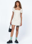 Front view of model wearing  front Princess Polly Square Neck  Hastings Mini Dress Beige