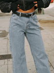 Front view of model wearing  front Princess Polly Low Rise Jeans  Maple Flare Jean Light Wash Denim