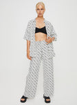 Front view of model wearing  front Princess Polly High Waisted Pants  Zodiac Linen Blend Pants Black / White