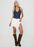 front view of model wearing Princess Polly Yukiyo Denim Top Mid Wash Sleeveless V-Neck 