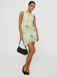 side view of model wearing Princess Polly Vivre Mini Dress Green Floral Crew Neck 