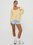 side view of model wearing Princess Polly Daxtan Cable Cardigan Lemon Cropped 