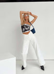 Front view of model wearing  front Princess Polly Mid Rise  Karol V-waist Jeans White Denim