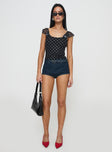 side view of model wearing Princess Polly Beckinsale Polka Top Black Short Sleeves Scoop Neck 