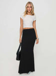   front view of model wearing Princess Polly Topping Maxi Skirt Black Petite Maxi 