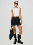 front view of model wearing Princess Polly Gazelle Denim Skort Washed Black High Waisted Shorts 