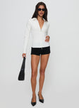 front view of model wearing Princess Polly Bellar Long Sleeve Top Ivory Full Sleeves V-Neck 