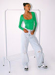 front view of model wearing Princess Polly Crosby Long Sleeve Bodysuit Green Full Sleeves Scoop Neck 