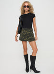 front view of model wearing Princess Polly Remington Skort Green Camo mid-rise 