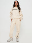 front view of model wearing Princess Polly Princess Polly Track Pants Block / Cursive Text Stone Mid Rise 