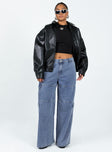 Black bomber jacket Faux leather material Pointed collar Twin hip pockets Elasticated waistband  Single button cuff