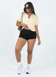 Front view of model wearing  front Princess Polly Short Sleeves Crew Neck  Box Avenue Polo Buttercream