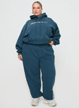 front view of model wearing Princess Polly Princess Polly Track Pants Block / Cursive Text Slate Curve 