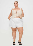 front view of model wearing Princess Polly Dobby Shorts White Curve 