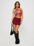   side view of model wearing Princess Polly Karley Low Waist Mini Skirt Burgundy Mini Skirts 