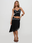   side view of model wearing Princess Polly Pappilion Asymmetrical Midi Skirt Black Midi Skirts 