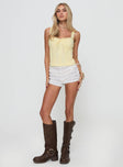 front view of model wearing Princess Polly Stellah Top Yellow Sleeveless Sweetheart 