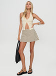 front view of model wearing Princess Polly Gigi Skort Beige Stripe High Waisted Shorts 