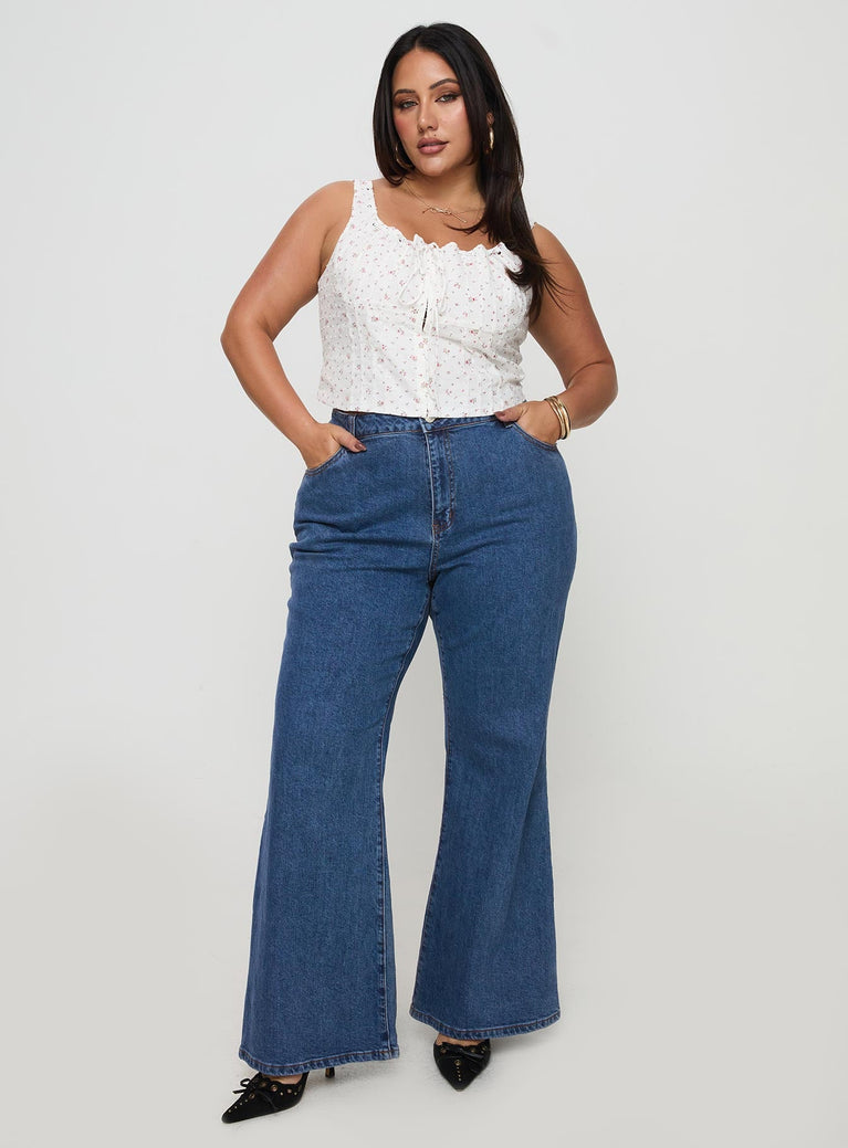 front view of model wearing Princess Polly Lucille High Rise Flare Leg Jeans Mid Wash Curve High Waisted 