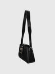 Shoulder bag Faux leather, adjustable strap, silver-toned hardware, buckle detail, zip closure