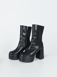 Boots Faux leather material  Mid-calf length  Zip fastening at side  Rounded toe Platform base  Block heel  Treaded sole