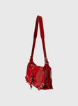 Shoulder bag Faux leather, adjustable strap, zip and button closure, silver-toned hardware, flat base, internal pockets