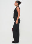 side view of model wearing Princess Polly Flounce Pants Black High Waisted Pants 