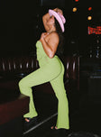 side view of model wearing Princess Polly Mid Way Laced Flare Pants Green Curve 