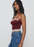 side view of model wearing Princess Polly Top Model Cami Burgundy Sleeveless Sweetheart 