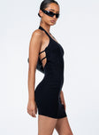 side view of model wearing Princess Polly Jessi Mini Dress Black Scoop Neck 