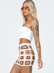   side view of model wearing Princess Polly Barbados Crotchet Mini Skirt Multi 