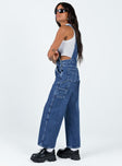 Overalls Mid wash denim  Embroidered graphic at chest  Adjustable shoulder straps Chest & leg pockets Four classic pockets  Button fastening at hips Wide leg 