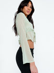 side view of model wearing Princess Polly Kenney Long Sleeve Top Green Full Sleeves Sweetheart 