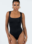 front view of model wearing Princess Polly Zoe Bodysuit Black Sleeveless Scoop Neck 