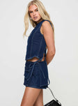 side view of model wearing Princess Polly Countryside Skort Blue Denim Low Rise Shorts 