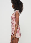 side view of model wearing Princess Polly Trigg Mini Dress Pink Floral Plunger 