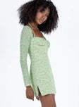 Front view of model wearing  front Princess Polly Square Neck  Dyer Sheer Sleeve Mini Dress Green Floral