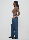 side view of model wearing Princess Polly Forestier Pin Tuck Jeans Mid Blue High Waisted 